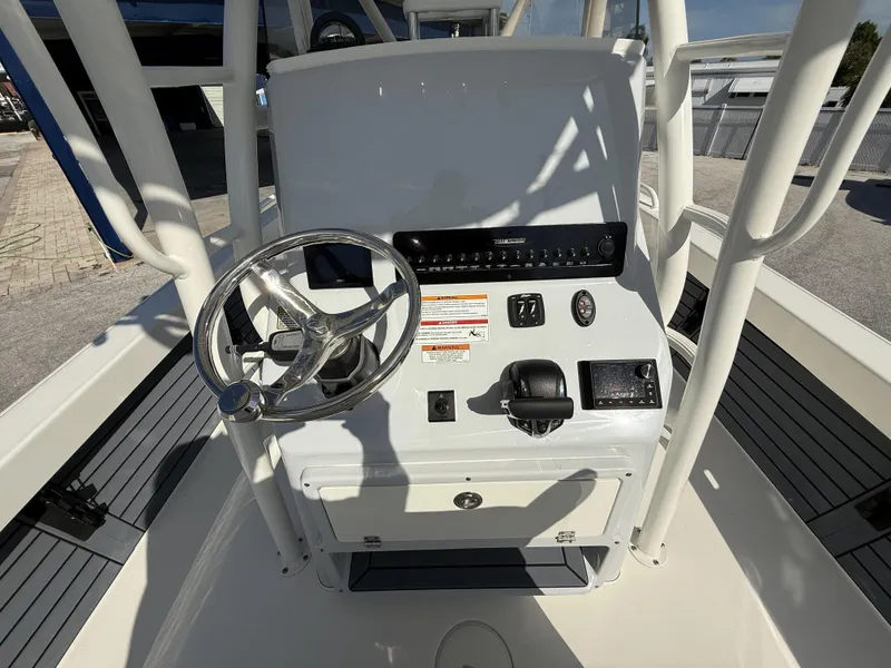 Slide: The Image of 2025 Pathfinder 2600 TRS boat console with steering wheel and controls. - 32