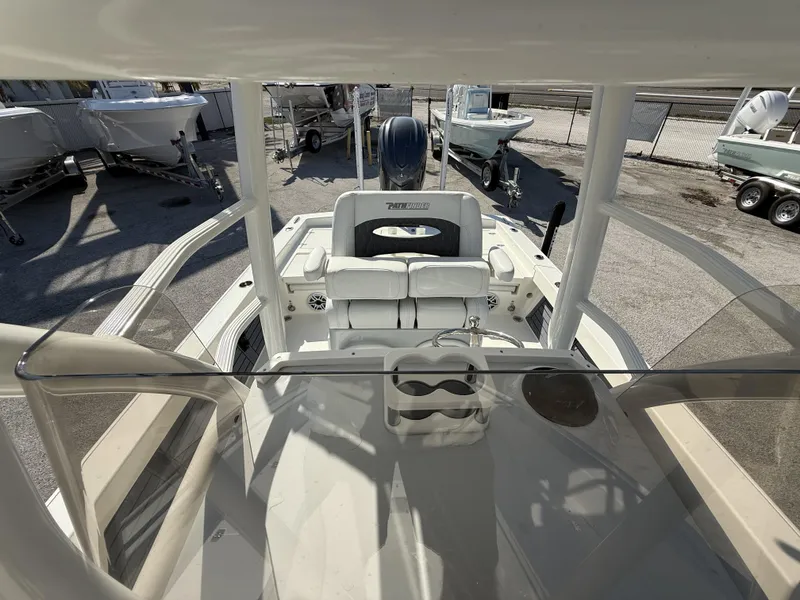 Slide: The Image of 2025 Pathfinder 2600 TRS boat interior view with seating and console. - 37