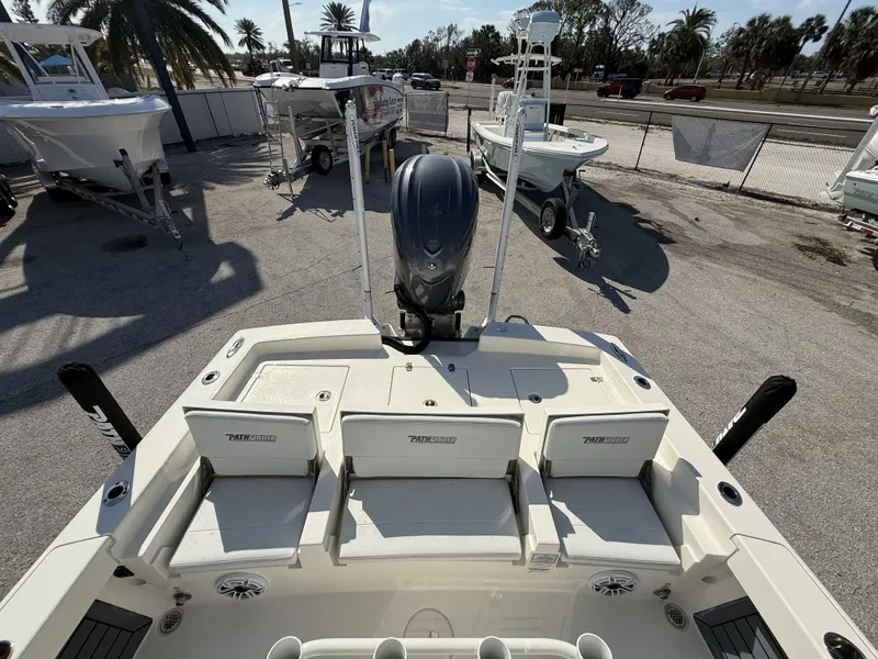 Slide: The Image of 2025 Pathfinder 2600 TRS boat with seating and motor, displayed outdoors. - 40