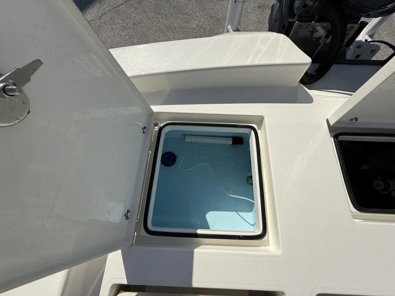 Slide: The Image of Open storage compartment on 2025 Pathfinder 2600 TRS boat deck. - 42