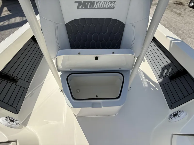 Slide: The Image of 2025 Pathfinder 2600 TRS boat interior with storage compartment and seating. - 49