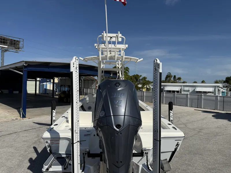 Slide: The Image of 2025 Pathfinder 2600 TRS boat with Yamaha 350 engine, docked under clear blue sky. - 5