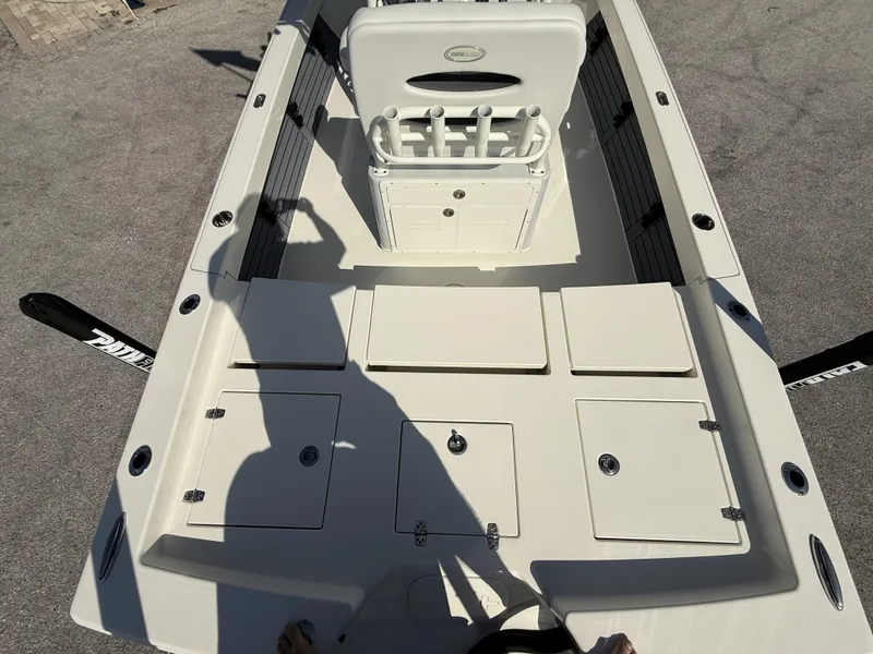 Slide: The Image of 2025 Pathfinder 2600 TRS boat interior with storage compartments and seating. - 8