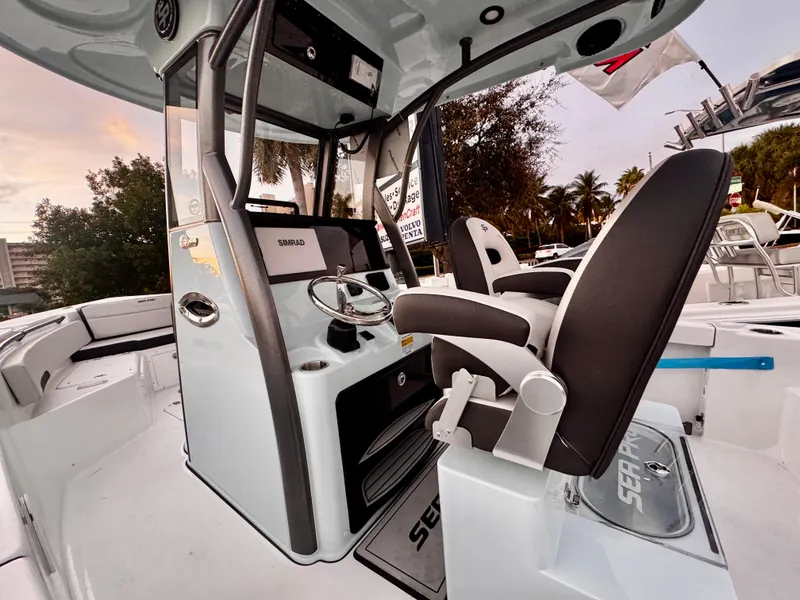 Slide: The Image of 2025 Sea Pro 245 FLX boat interior with helm and seating. - 12