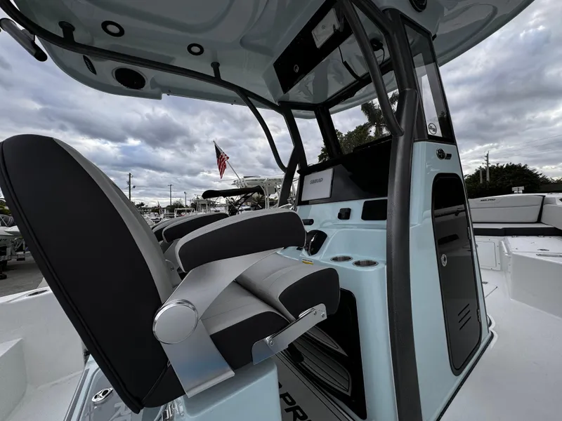 Slide: The Image of 2025 Sea Pro 245 FLX boat interior with modern seating and control panel. - 32