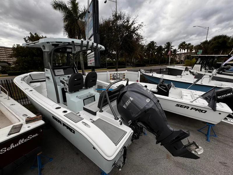 Slide: The Image of 2025 Sea Pro 245 FLX boat with Yamaha outboard motor, displayed outdoors. - 38
