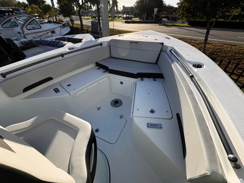 Slide: The Image of 2025 Sea Pro 245 FLX boat interior with seating and storage compartments. - 49