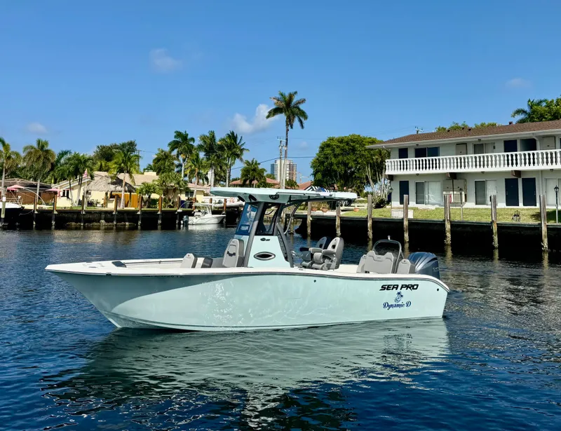 Slide: The Image of 2025 Sea Pro 245 FLX boat with dining setup on rear platform. - 5