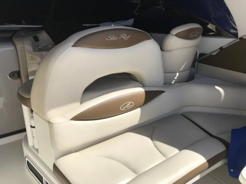 Slide: The Image of 2001 Sea Ray Sundancer boat interior with beige and brown seating. - 6