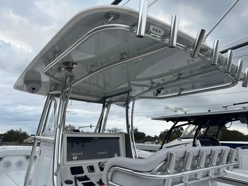 Slide: The Image of 2021 Contender 39 ST boat with sleek console and advanced Garmin navigation system. - 10