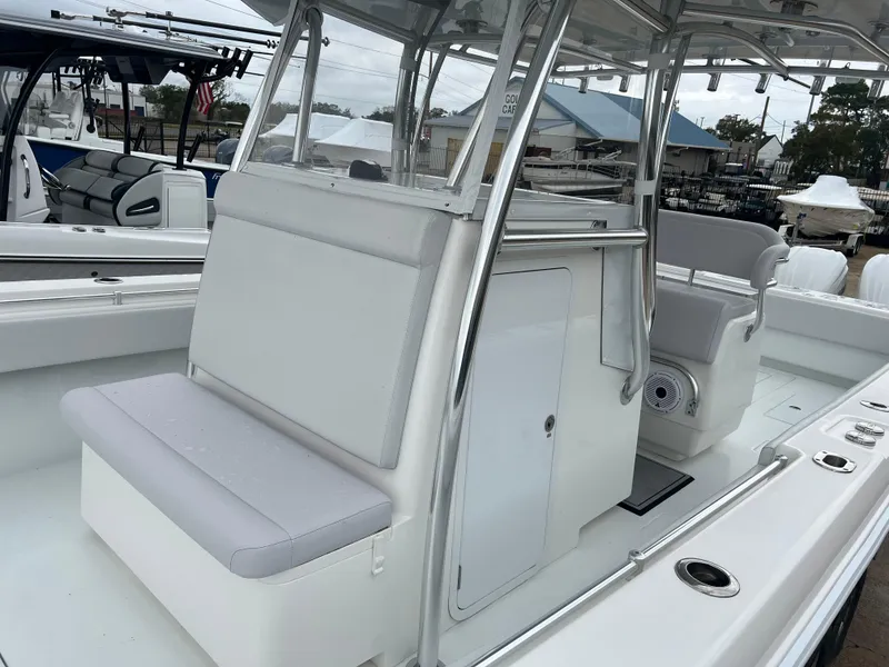 Slide: The Image of 2021 Contender 39 ST boat interior with seating and console, showcasing sleek design and functionality. - 12
