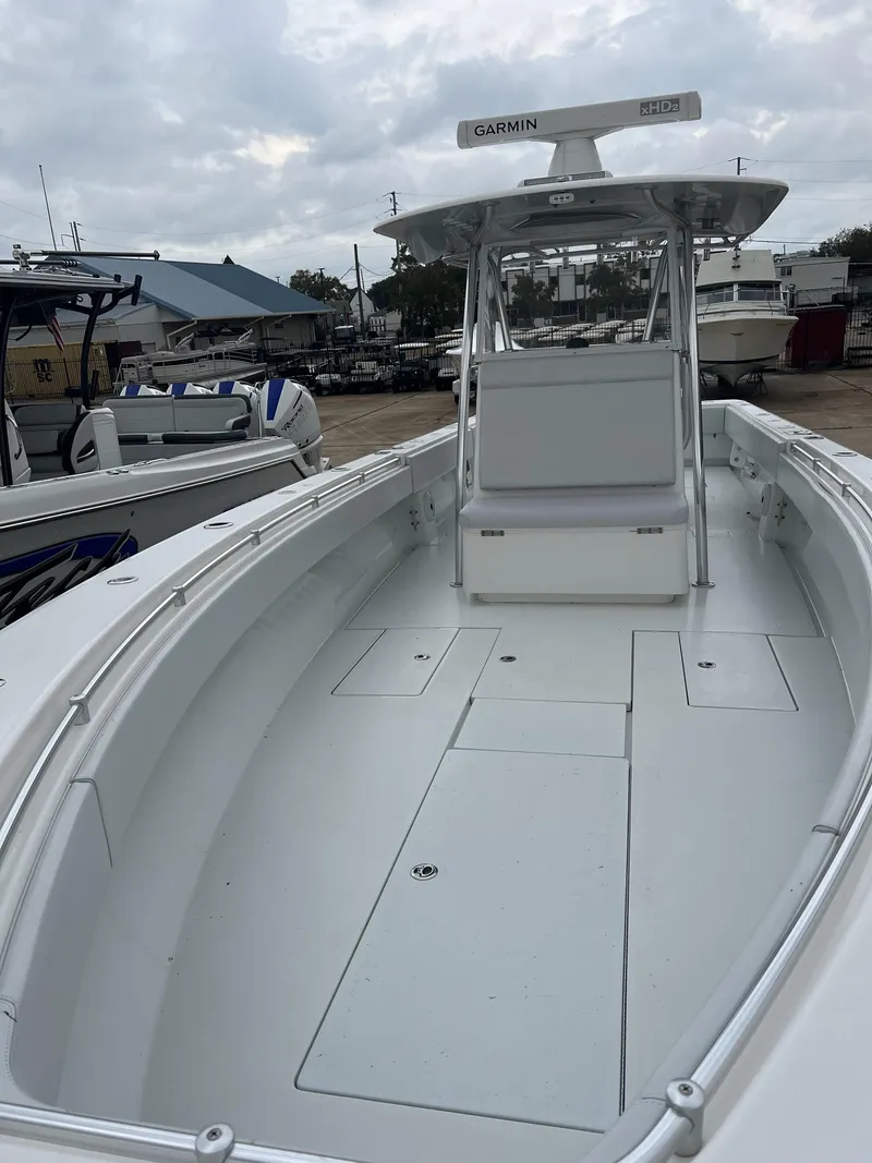 Slide: The Image of 2021 Contender 39 ST boat with Garmin radar, docked at a marina. - 14