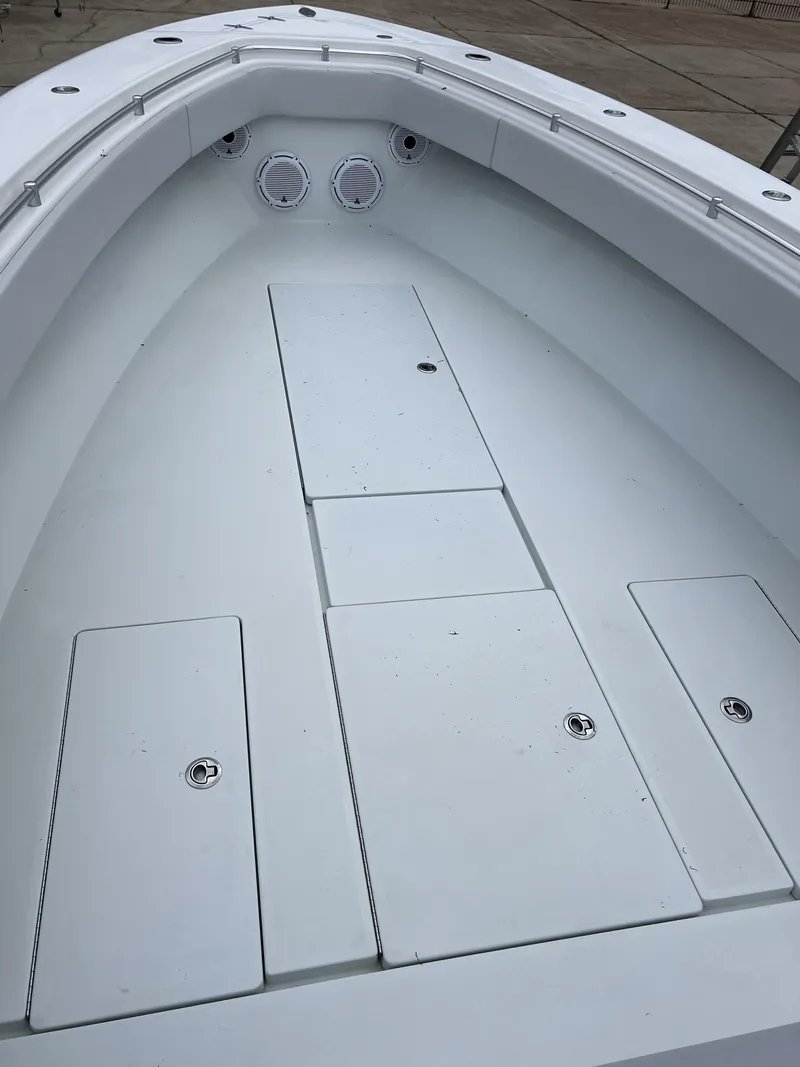 Slide: The Image of 2021 Contender 39 ST boat deck with storage compartments and seating. - 21