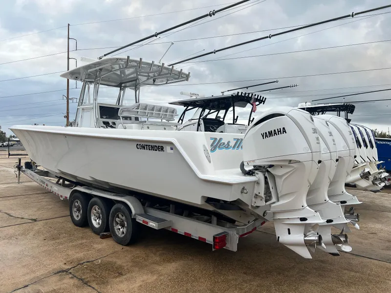 Slide: The Image of 2021 Contender 39 ST boat with Yamaha engines on a trailer. - 5