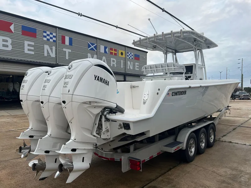 Slide: The Image of 2021 Contender 39 ST boat with triple Yamaha engines at Bent Marine dealership. - 7