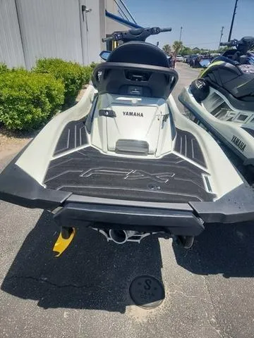 Slide: The Image of 2025 Yamaha WaveRunner FX Cruiser HO, rear view, parked outdoors on sunny day. - 8