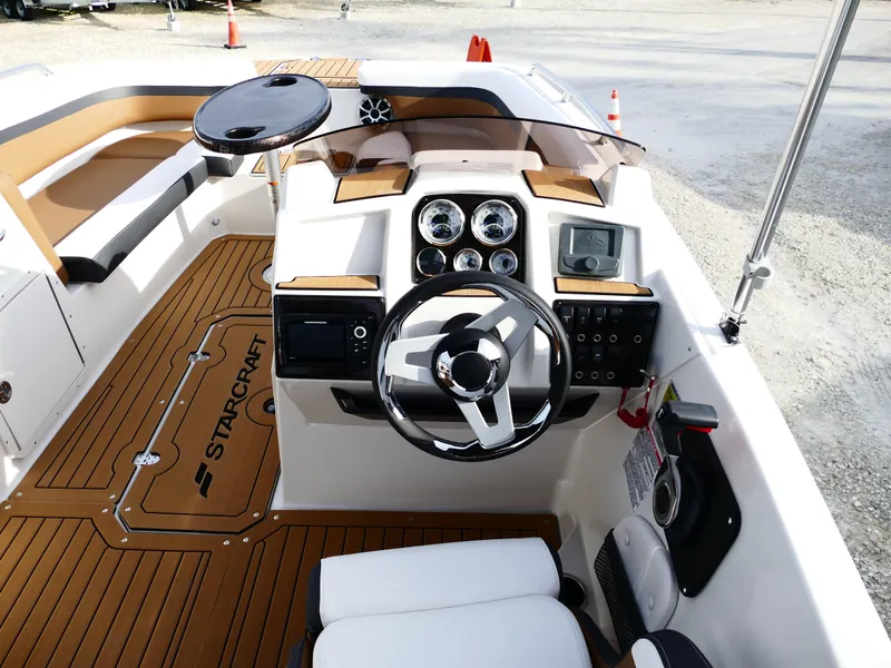 Slide: The Image of 2025 Starcraft SVX 211 OB boat interior with modern dashboard and steering wheel. - 11