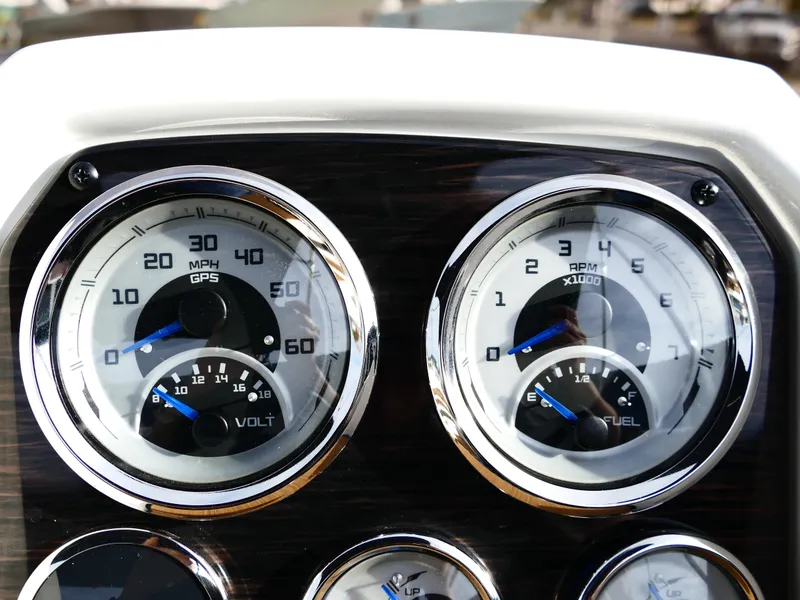 Slide: The Image of Dashboard of 2025 Starcraft SVX 211 OB boat with speedometer and fuel gauges. - 12