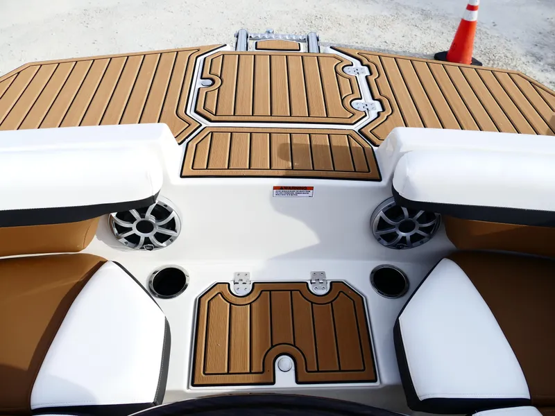 Slide: The Image of 2025 Starcraft SVX 211 OB boat deck with teak flooring and seating. - 18