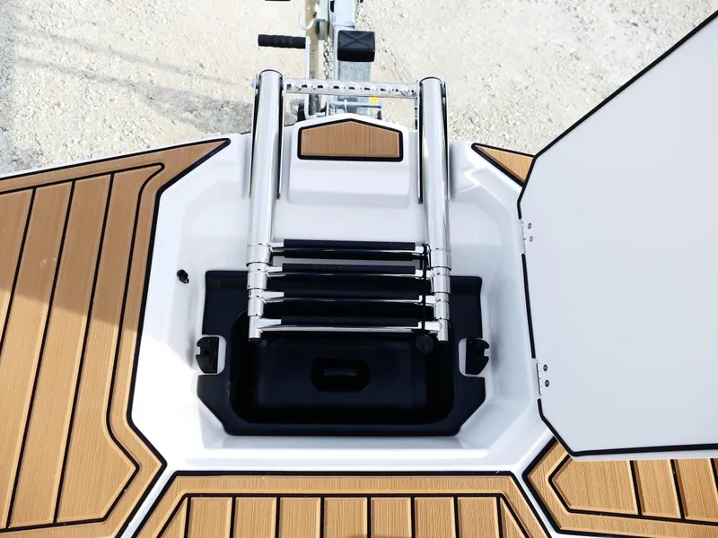 Slide: The Image of 2025 Starcraft SVX 211 OB boat ladder and deck detail. - 20