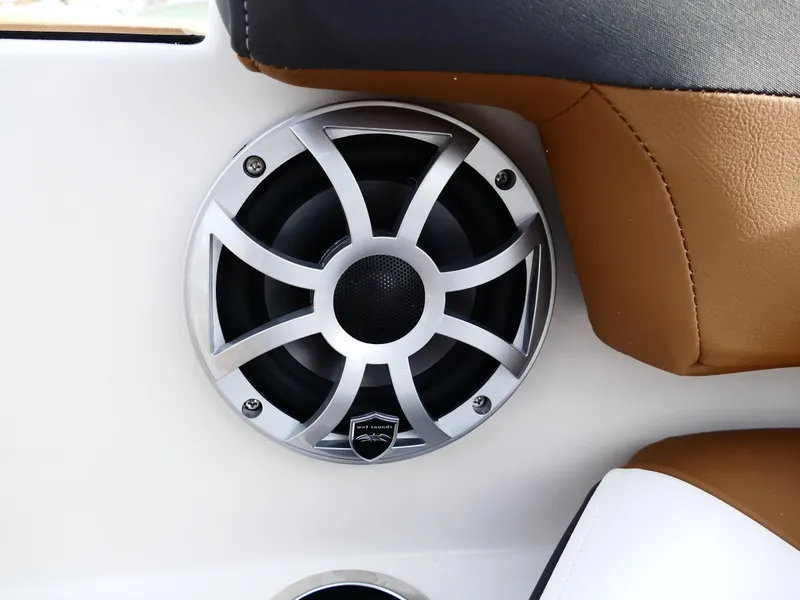 Slide: The Image of 2025 Starcraft SVX 211 OB boat speaker with sleek design and brown seating. - 24