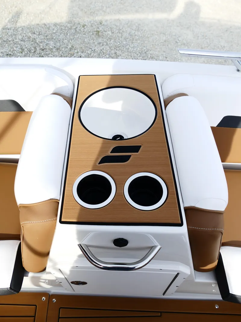 Slide: The Image of 2025 Starcraft SVX 211 OB boat interior with cup holders and sleek design. - 25