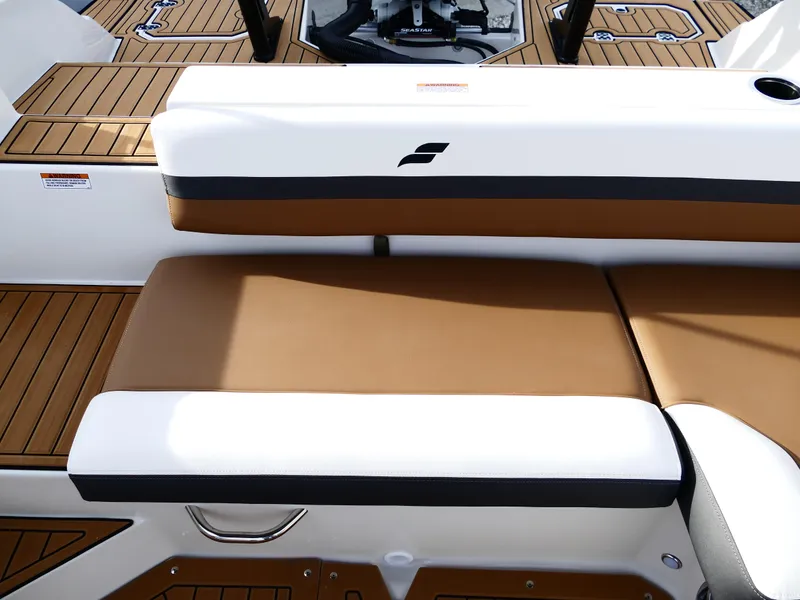 Slide: The Image of 2025 Starcraft SVX 211 OB boat interior with brown and white seating. - 32
