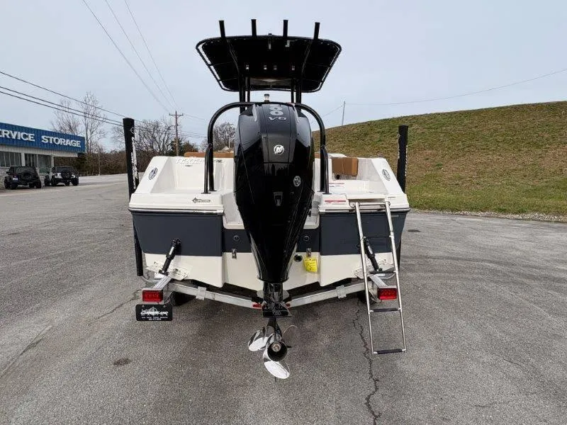 Slide: The Image of 2025 Robalo 202 EXPLORER boat rear view with outboard motor and ladder. - 12