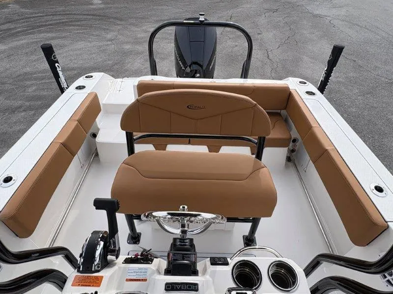 Slide: The Image of 2025 Robalo 202 EXPLORER boat interior with tan seating and modern controls. - 22