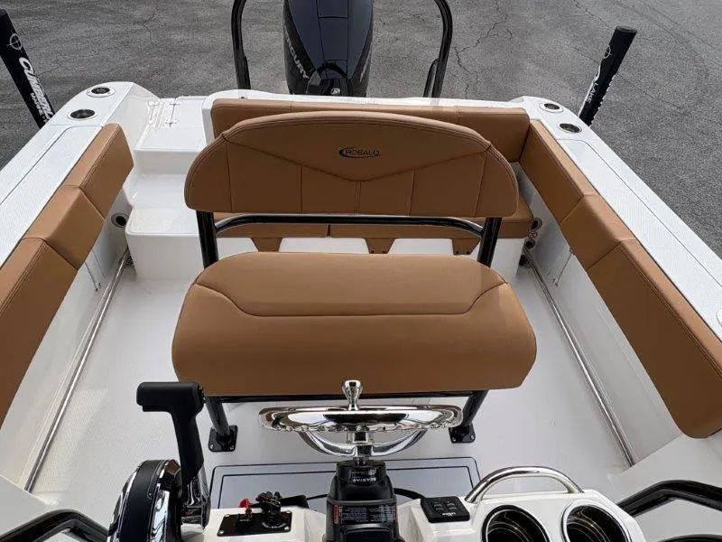 Slide: The Image of 2025 Robalo 202 EXPLORER boat interior with tan seating and steering wheel. - 36