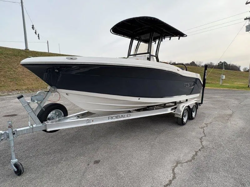Slide: The Image of 2025 Robalo 202 EXPLORER boat on trailer, parked on paved surface. - 4