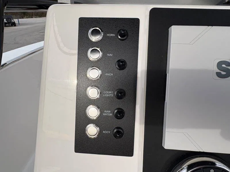 Slide: The Image of Control panel of 2025 Robalo 202 EXPLORER boat with labeled switches. - 40