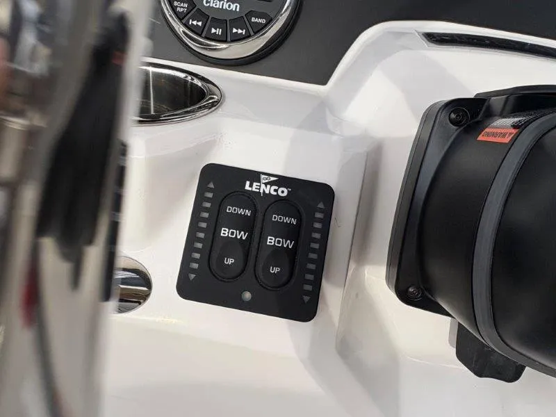 Slide: The Image of Control panel of 2025 Robalo 202 EXPLORER boat with Lenco trim tab switches. - 41