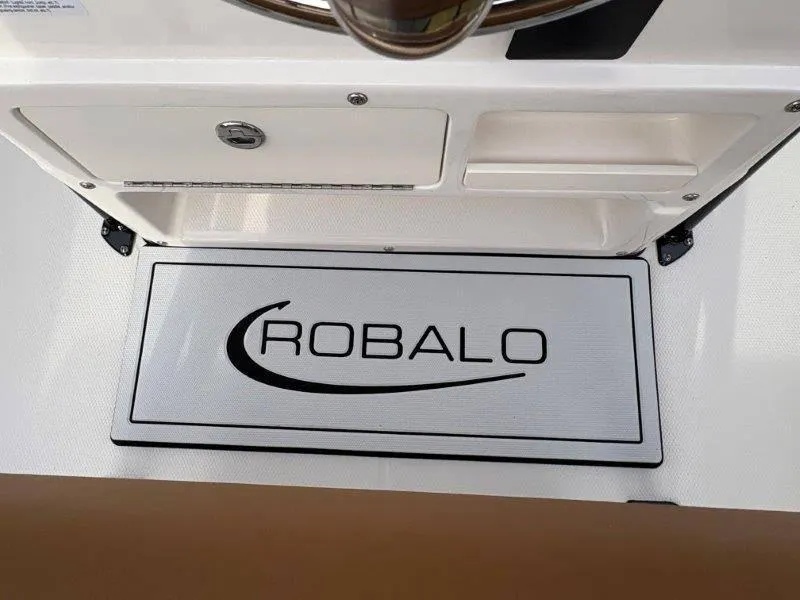 Slide: The Image of 2025 Robalo 202 EXPLORER boat interior with logo on deck mat. - 47