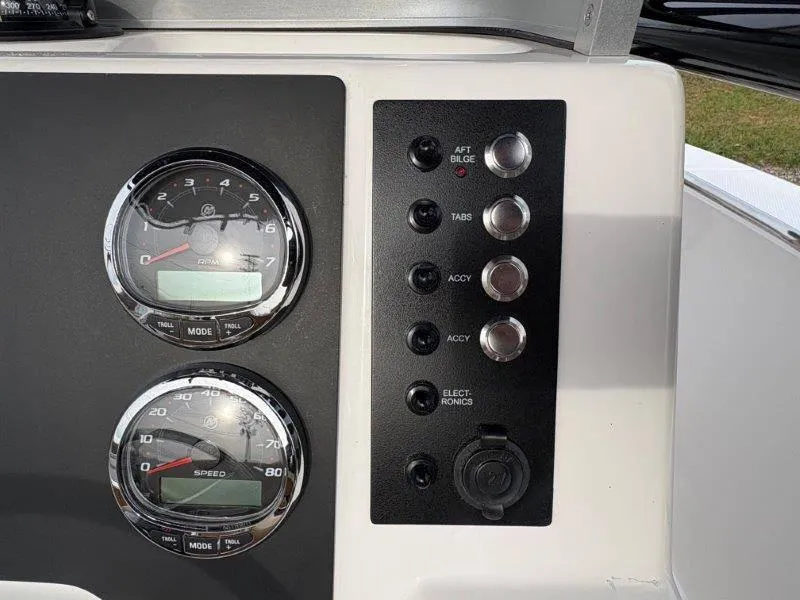 Slide: The Image of Dashboard of 2025 Robalo 202 EXPLORER with gauges and control switches. - 49