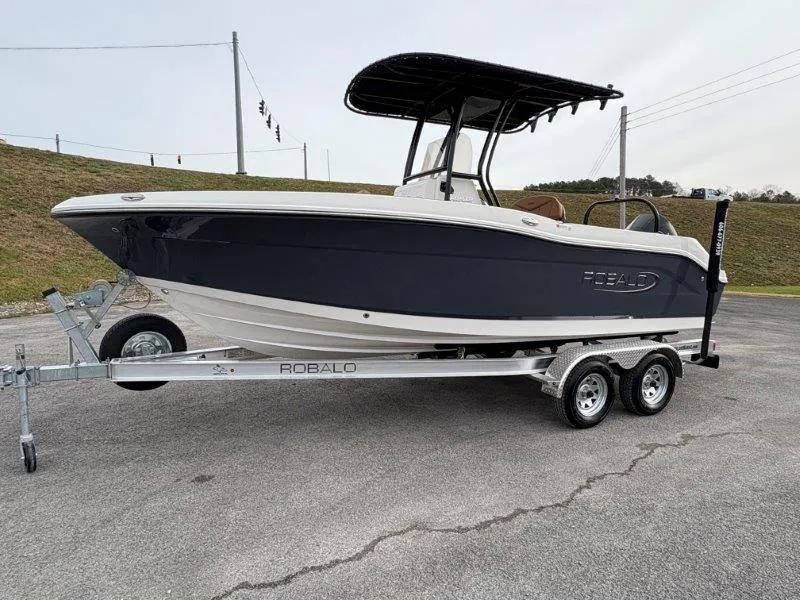 Slide: The Image of 2025 Robalo 202 EXPLORER boat on trailer, parked outdoors. - 5