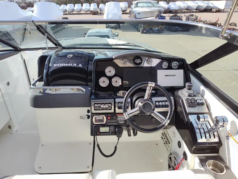 Slide: The Image of 2018 Formula 350 Crossover Bowrider dashboard with steering wheel and controls. - 13