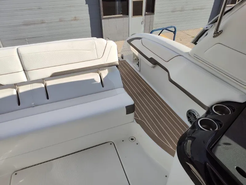 Slide: The Image of 2018 Formula 350 Crossover Bowrider interior with white seating and wood-style flooring. - 15