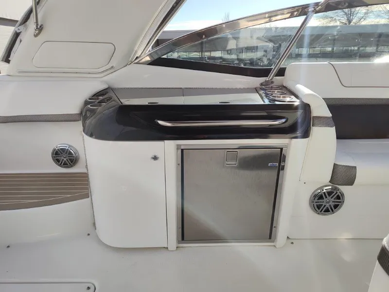 Slide: The Image of 2018 Formula 350 Crossover Bowrider interior with sleek cabinetry and stainless steel accents. - 19