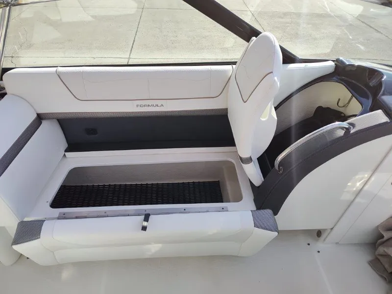 Slide: The Image of 2018 Formula 350 Crossover Bowrider interior seating with storage compartment. - 21