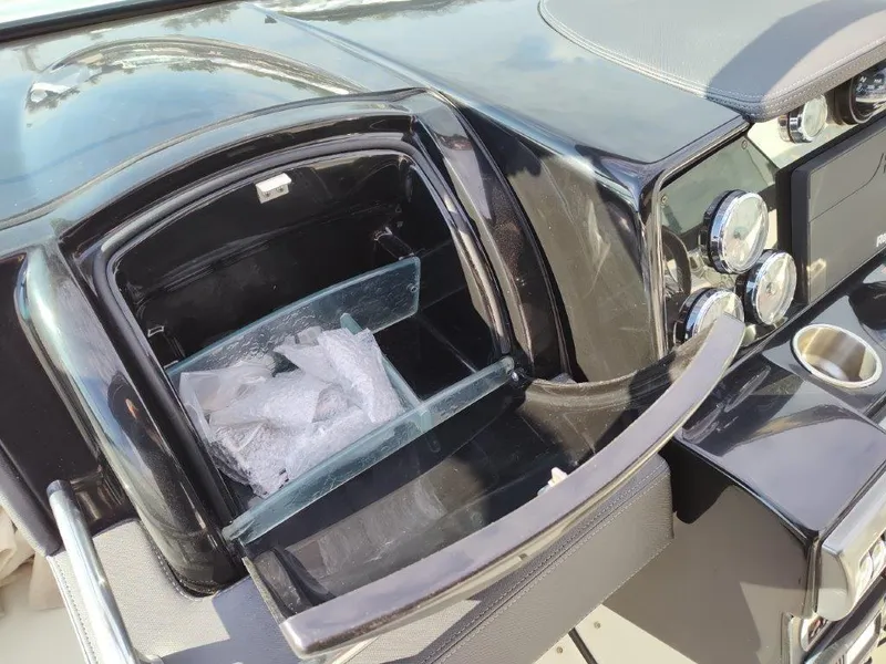 Slide: The Image of 2018 Formula 350 Crossover Bowrider dashboard with open storage compartment. - 23