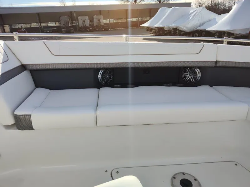 Slide: The Image of 2018 Formula 350 Crossover Bowrider with white seating and built-in speakers. - 28