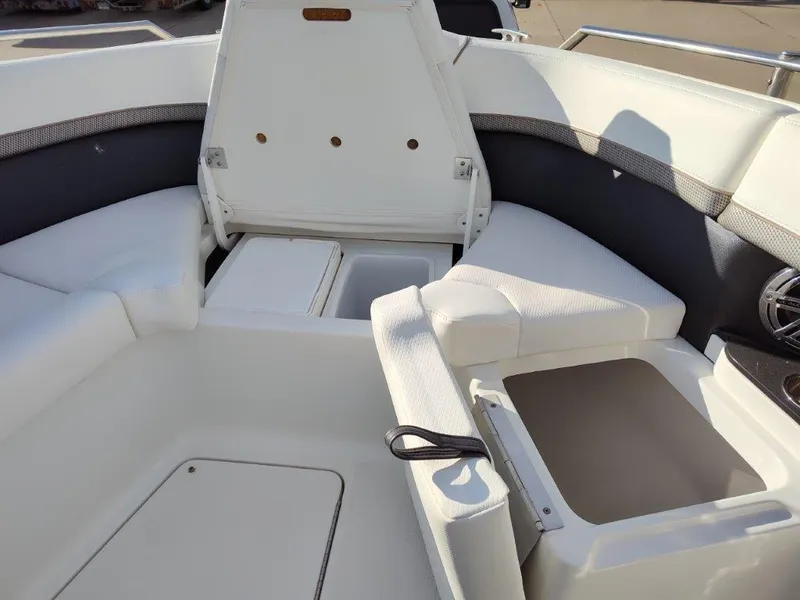 Slide: The Image of 2018 Formula 350 Crossover Bowrider interior with white seating and storage compartments. - 30