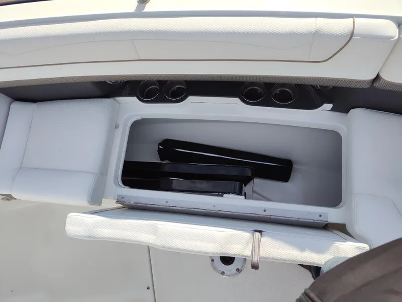 Slide: The Image of 2018 Formula 350 Crossover Bowrider storage compartment with cup holders and seating. - 31