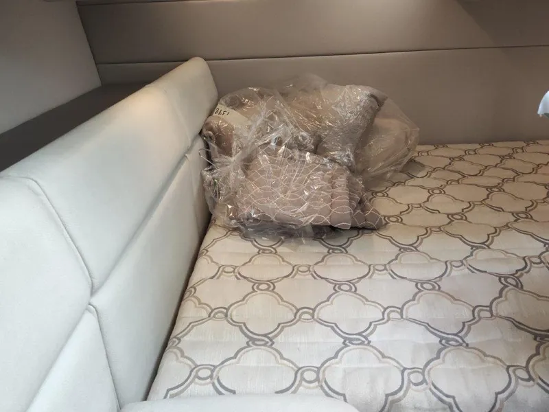 Slide: The Image of 2018 Formula 350 Crossover Bowrider cabin with patterned bedding and pillows. - 36
