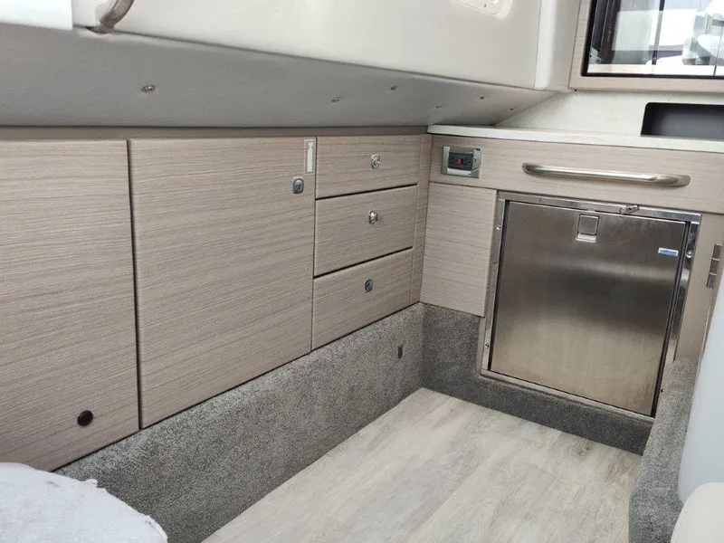 Slide: The Image of 2018 Formula 350 Crossover Bowrider interior with modern cabinetry and stainless steel accents. - 39
