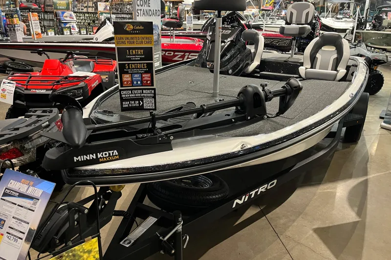Slide: The Image of 2025 Nitro Z18 boat with Minn Kota Maxxum motor on display in showroom. - 1