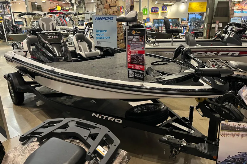 Slide: The Image of 2025 Nitro Z18 boat on display in a showroom, featuring sleek design and modern equipment. - 2