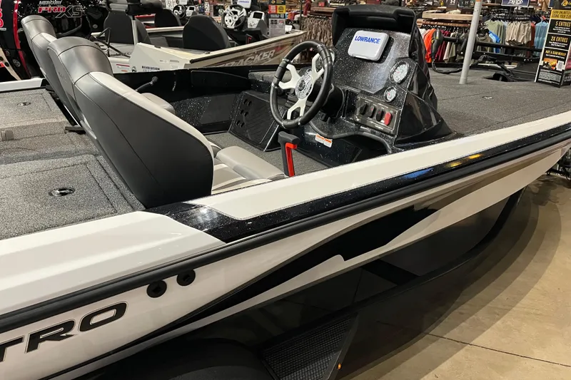 Slide: The Image of 2025 Nitro Z18 boat interior with steering wheel and seating, featuring modern design. - 5