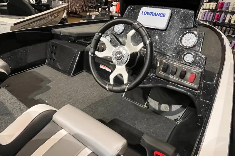 Slide: The Image of Interior of 2025 Nitro Z18 boat with steering wheel and dashboard controls. - 7